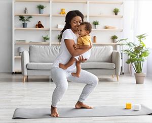 Woman practicing yoga as a postnatal workout for weight loss and well-being