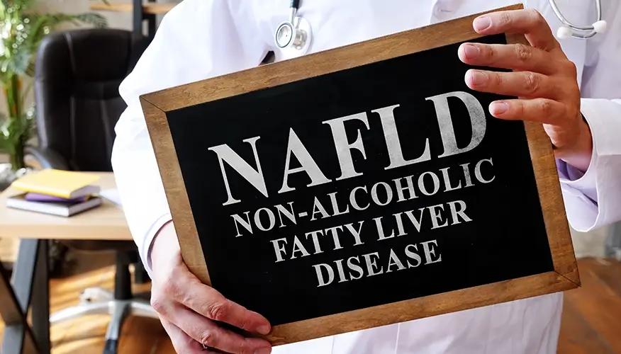 Doctor holding NAFLD (Non-Alcoholic Fatty Liver Disease) sign, liver health awareness.
