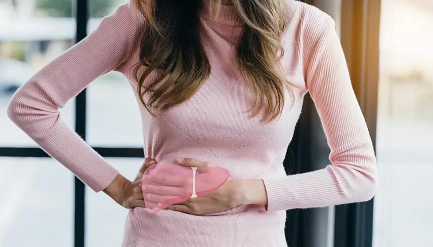 Woman holding her side with liver illustration, indicating liver pain or health issue.