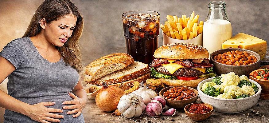 Woman suffering from bloating after eating foods that are known to cause bloating