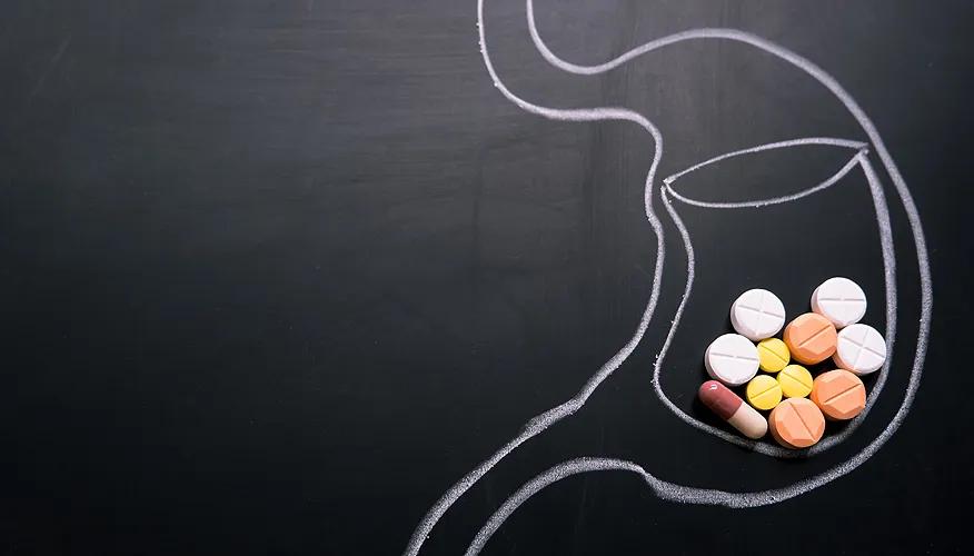 Stomach chalk drawing with pills inside